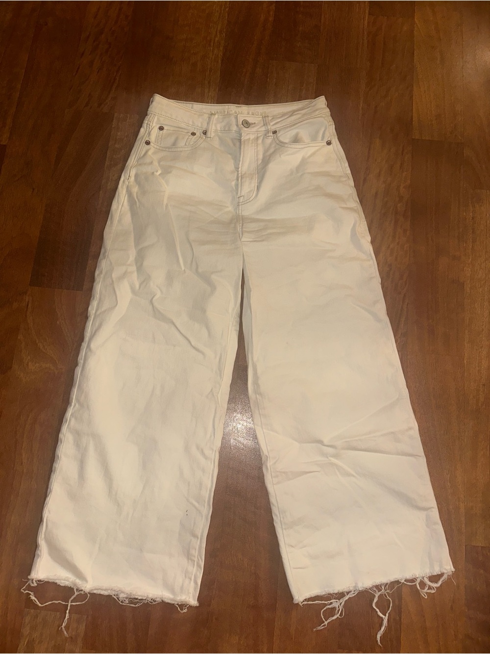 American Eagle High-Rise Wide-Leg Raw-Hem Crop Jeans in Cream